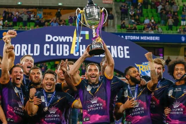 Melbourne Storm celebrate with the World Club Challenge trophy.