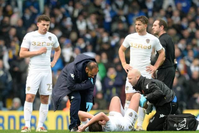 Luke Ayling picks up his injury against Nottingham Forest on New Year's Day.
