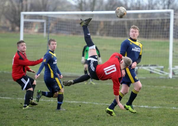 Rothwell's Charlie Holt acrobatically clears. 
Picture Tony Johnson.