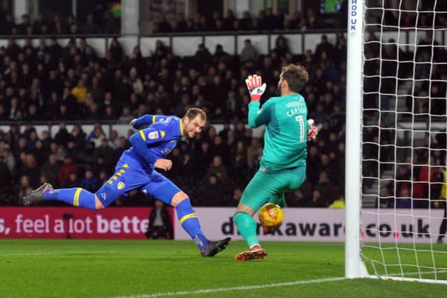 In-form striker Pierre-Michel Lasogga heads in the opening goal at Pride Park on Wednesday night. PIC: Tony Johnson
