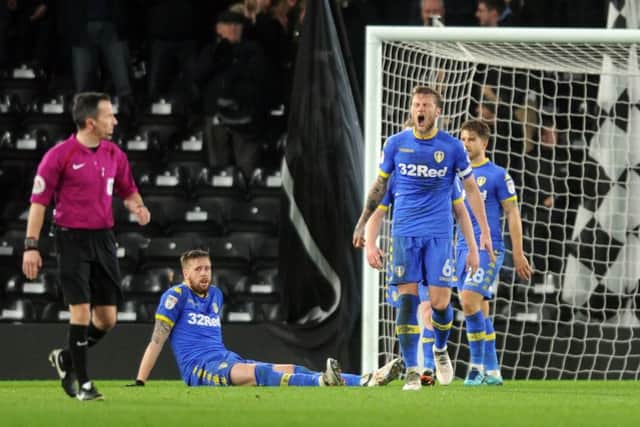 Leeds captain Liam Cooper and centre-back partner Pontus Jansson show their frustration after Derby's late, late equaliser. PIC: Tony Johnson