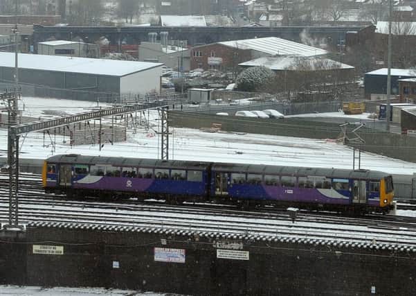 27 February 2018 .......     A train leaves Leeds station in a dusting of snow in the centre of Leeds.  Picture Tony Johnson