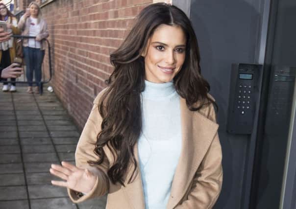 Cosy-chic and sleek was the order of the day when a chilly Cheryl stepped out to open the new Prince's Trust and Cheryl's Trust centre in Newcastle. Pale blue knit under camel tones equals modern pared-back, easy elegance. Danny Lawson/PA Wire