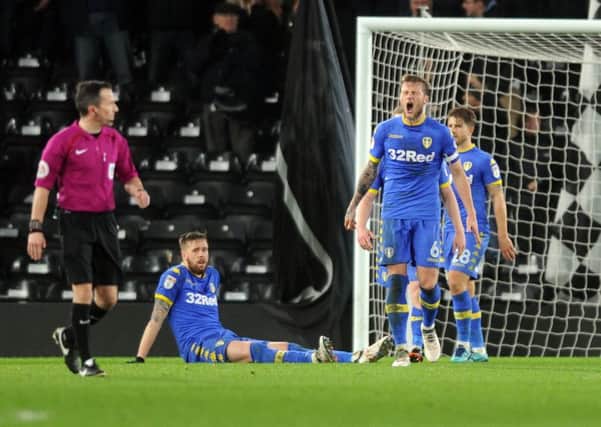 Leeds United's captain Liam Cooper shows his anger at conceding a late equaliser at Derby.