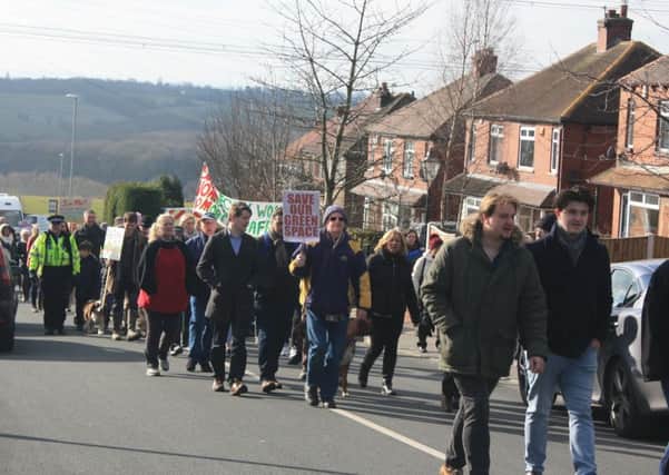 Walk: Dozens of campaigners took part in the peaceful procession through the streets, organised by the West Ardsley Action Group.