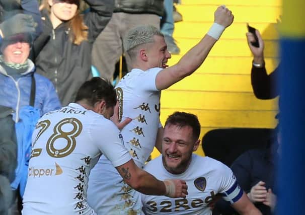 PERFECT RESPONSE: From Leeds United captain Liam Cooper, pictured right, celebrating the only goal of the game with Gjanni Alioski, centre, and Gaetano Berardi.