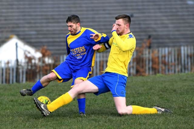 Seacroft's Peter Benn is tackled by Halfway House's Jordan Heyes. PIC: Jonathan Gawthorpe