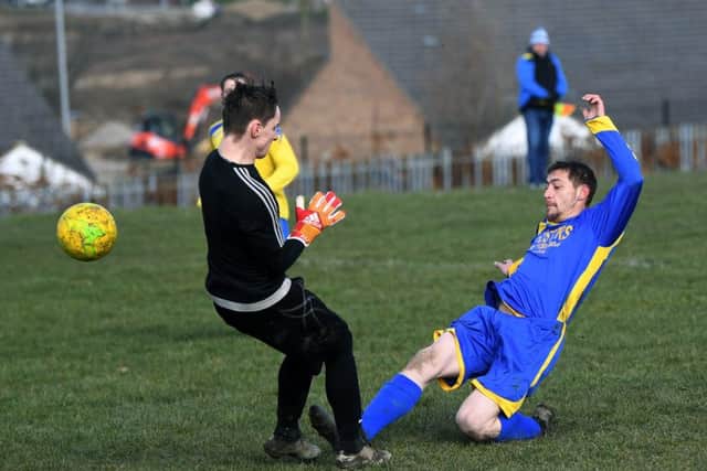 Seacroft's Gary Crossley beats Halfway House goalkeeper Callen Burke, but fails to hit the target. PIC: Jonathan Gawthorpe