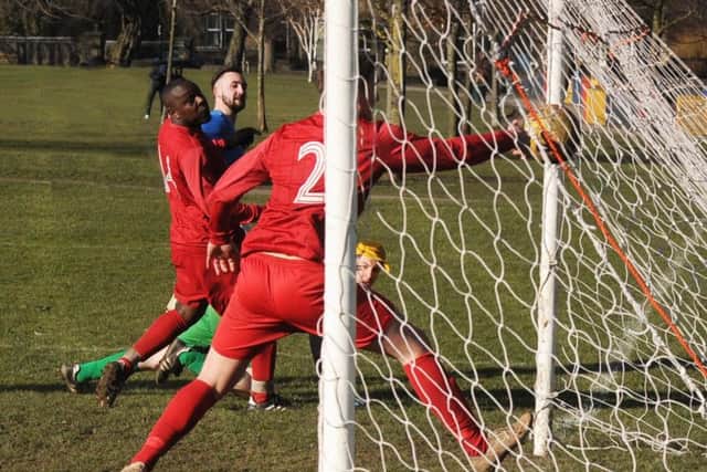 Matthew Wilson scores for Calverley who went top of the Championship on the back of a 4-0 win over visitors Leeds Independent. PIC: Steve Riding