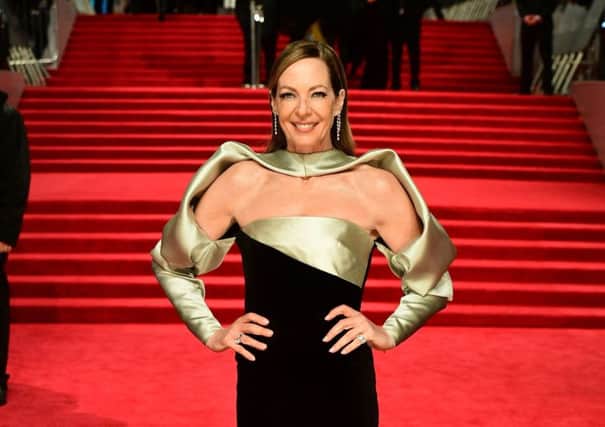 Shall we go black? Or smokey silver? Dang it, let's do both! Best supporting actress nominee Allison Janney's opulent metallic satin sleeves streched the all-black brief at the Baftas. Ian West/PA Wire.