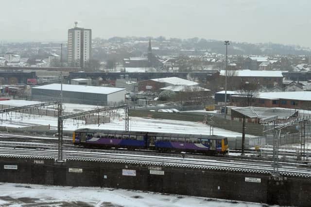 A train leaves Leeds station in a dusting of snow in the centre of Leeds this morning.  Picture Tony Johnson