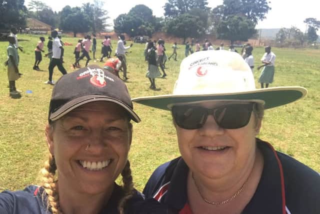 Clare Sanderson with one of the volunteers she met on a trip to Uganda last year