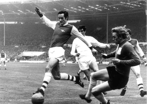 Leeds United's Norman Hunter closes down Arsenal's George Graham during the 1968 League Cup final.