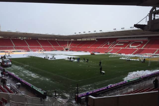 Middlesbrough groundstaff have made progress clearing the pitch of snow at The Riverside.