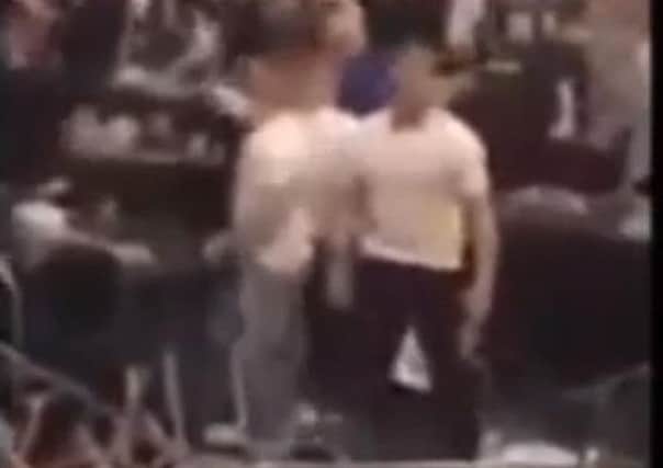 A still image from the video of a brawl at an Elland Road boxing event.