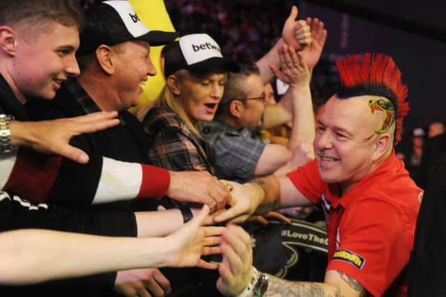 Peter Wright is welcomed to Leeds Arena last year.