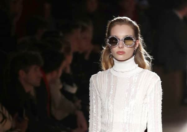 GET THE LOOK: It was all about the full glossy pout on the Milan catwalk this week for the the Roberto Cavalli fall/winter 2018-2019 collection. The perfect foil for creamy white, try Buxom Full-On Lip Cream, Â£15, to get the look right (AP Photo/Antonio Calanni).