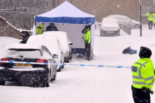 The woman was found dead in the street in the snow