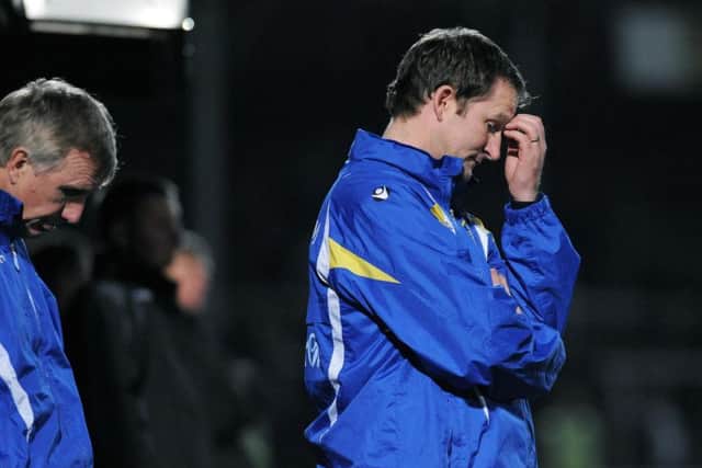 Simon Grayson reacts during Leeds' 2-0 defeat to Hereford United in 2009 after the first fixture was postponed.