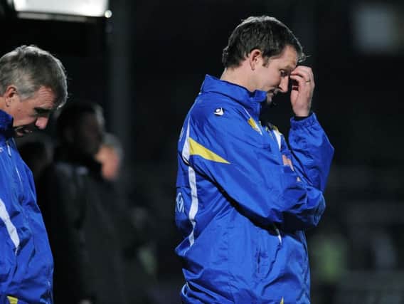 Simon Grayson reacts during Leeds' 2-0 defeat to Hereford United in 2009 after the first fixture was postponed.