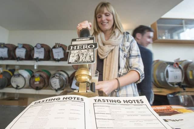 RAISE A GLASS: Hayley Baxter pulls a pint at a previous Morley Beer Festival.