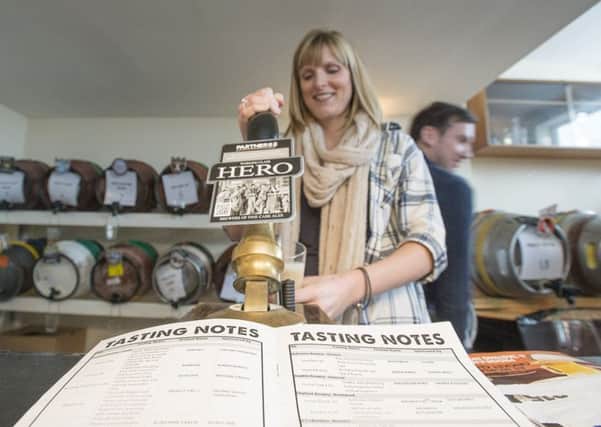 RAISE A GLASS: Hayley Baxter pulls a pint at a previous Morley Beer Festival.