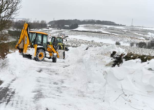 A JCB digger clearing snow drifts on Heights Lane, Eldwick.
2 March 2018.  Picture Bruce Rollinson