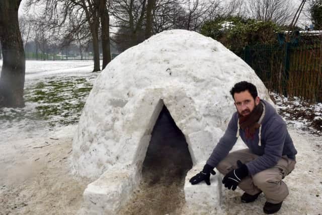 Ed Carlisle with the igloo in Cross Flatts Park, Beeston, Leeds. Picture: Steve Riding.