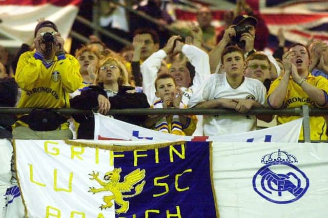 The Leeds United fans cheer their team from the top tier of the Estadio Santiago Bernabeu.