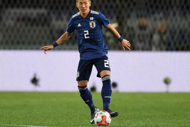 Yosuke Ideguchi in action for Japan.