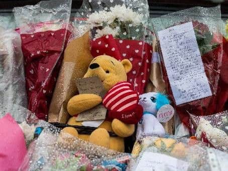 Floral tributes at the scene of the blaze on Second Avenue, Rothwell.