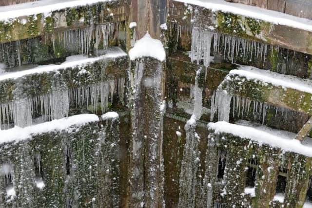 Icicle's hang from one of the lock gates at Five Rise Locks, Bingley.