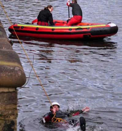 14 April 2015 .......      Firefighters stage a water rescue at the River Aire behind Asda House, Southbank, Leeds.  Picture Maisie Coulbert