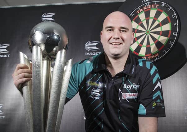 Rob Cross with the World Darts Championship Trophy. PIC: Steve Welsh/PA Wire