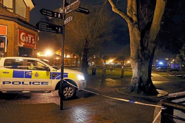 A police tent (at right in distance) near the Maltings in Salisbury where a man and a woman were found unconscious on a bench on Sunday. Former Russian double agent Sergei Skripal is critically ill following his suspected exposure to an unknown substance. Picture: PA