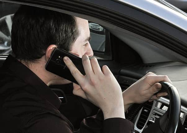 DESIRED EFFECT: Increased penalties for using your phone while driving has seen offending rates fall.
