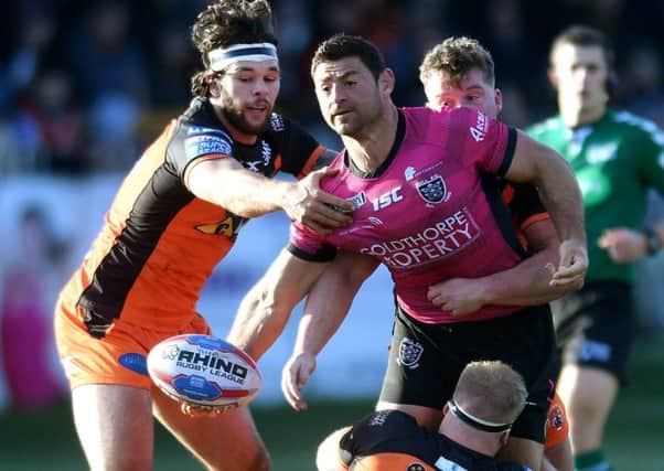 Alex Foster, Adam Milner and Oliver Holmes get to grips with 
Hull's Mark Minichiello. PIC: Jonathan Gawthorpe