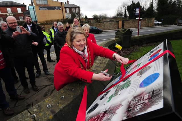 Lord Mayor of Leeds, Coun Jane Dowson, cuts the ribbon.