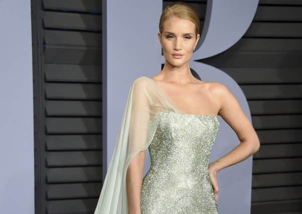 CELEB GET THE BEAUTY LOOK: 
Rosie Huntington-Whiteley arrives at the Vanity Fair Oscar Party looking serenely regal. The make-up is low-key and glow-y, blendy golden tawny shades and finished with a full nude semi-matte lip. Try MAC Matte Lipstick in Velvet Teddy, Â£17.50. (Photo by Evan Agostini/Invision/AP)