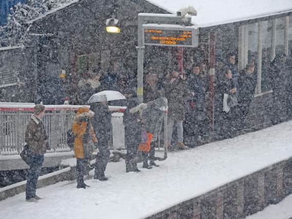 Commuters stuck at a railway station this morning