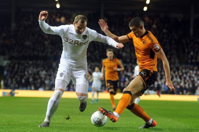 Pierre-Michel Lasogga is tackled by Wolves' Conor Coady.