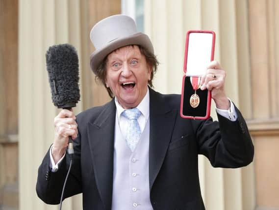 Veteran entertainer Sir Ken Dodd at Buckingham Palace after he was made a Knight Bachelor of the British Empire by the Duke of Cambridge last year. Picture: Yui Mok/PA Wire.