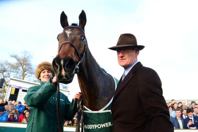 Douvan with trainer Willie Mullins and groom Rachel Robbins. PIC: PA Wire