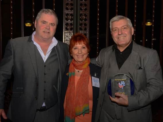 Tempus Novo founders Steve Freer and Val Wawrosz receive their award from Lady Corbett.