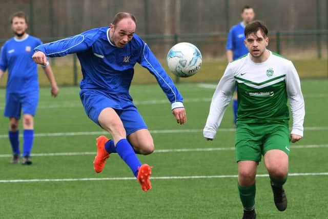 Harehills' Ricky Smith comes under pressure from Jason Prior, of Sporting Pudsey. PIC: Jonathan Gawthorpe