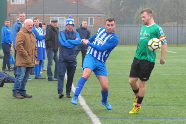 Jordan Watts knocks the ball down the wing for Beeston Juniors during the Yorkshire Amateur League Premier Division encounter with visitors St Nicholas. PIC: Steve Riding