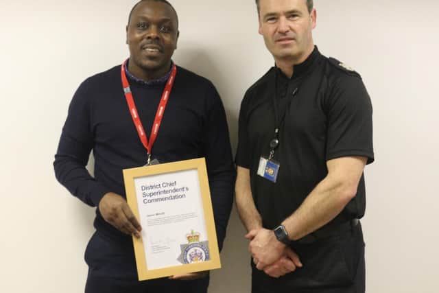 Jason Minott receives his commendation from Chief Superintendent Paul Money.