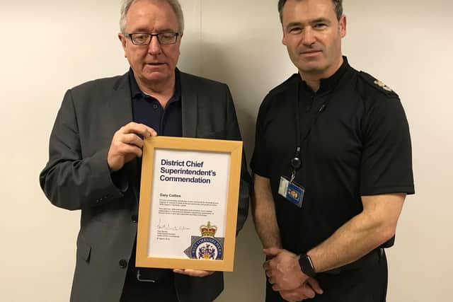 Gary Collins receives his commendation from Chief Superintendent Paul Money.