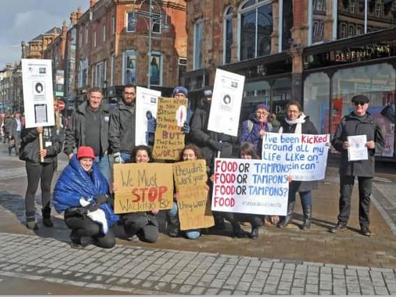 Rough sleeper charity Simon on the Streets changed its name to Simone on the Streets to highlight International Women's Day homeless women issue at Leeds Briggate rally.