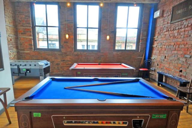 The top floor space has been given over to pool tables.